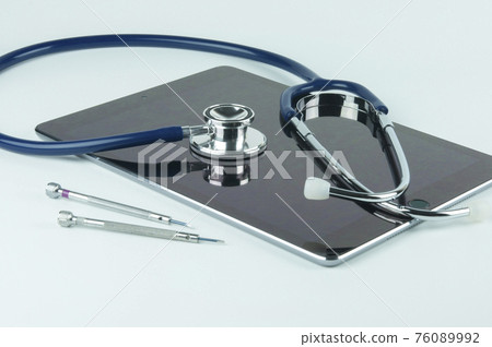 Stethoscope, tablet and screwdrivers. Stethoscope, tablet and screwdrivers. 76089992