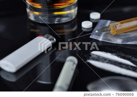 Cocaine, pills, alcohol and heroin in syringe. Cocaine, pills, alcohol and heroin in syringe. 76090008