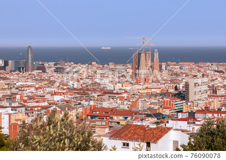 Sagrada Familia and The Torre Glories, formerly known as Torre Agbar with Barcelona and the sea Sagrada Familia and The Torre Glories, formerly known as Torre Agbar with Barcelona and the sea 76090078