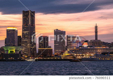 Yokohama cityscape of Japan New scenery of Minato Mirai, Yokohama. Asuka II and Royal Wing that shine in the sunset (in front of Asuka II) Yokohama cityscape of Japan New scenery of Minato Mirai, Yokohama. Asuka II and Royal Wing that shine in the sunset (in front of Asuka II) 76090311