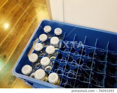 Drinks in a bottle after a public bath Drinks in a bottle after a public bath 76091093