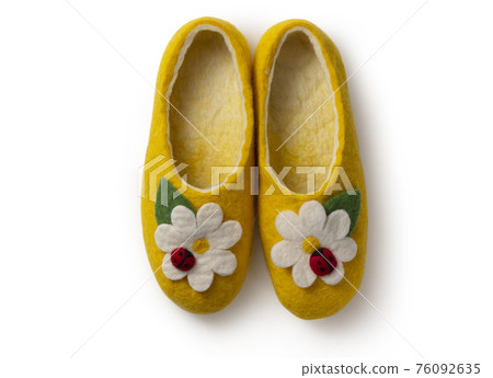 Felt slippers on white background in closeup 76092635
