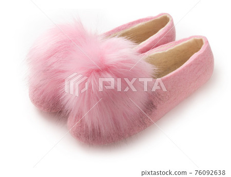 Felt slippers on white background in closeup Felt slippers on white background in closeup 76092638
