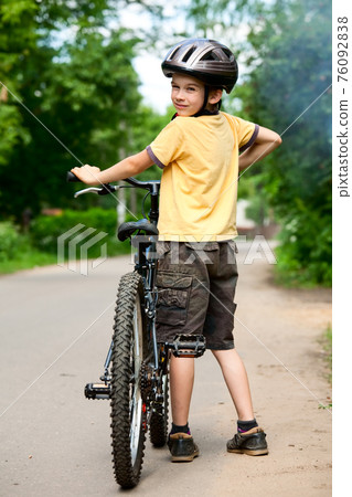 Kid with bicycle Kid with bicycle 76092838