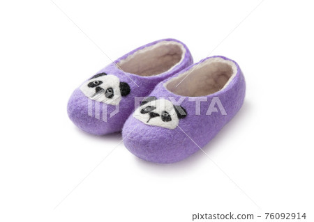 Felt slippers on white background in closeup Felt slippers on white background in closeup 76092914