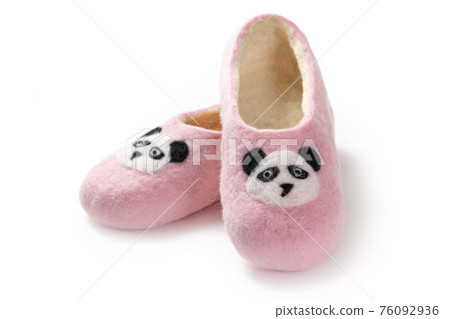 Felt slippers on white background in closeup Felt slippers on white background in closeup 76092936