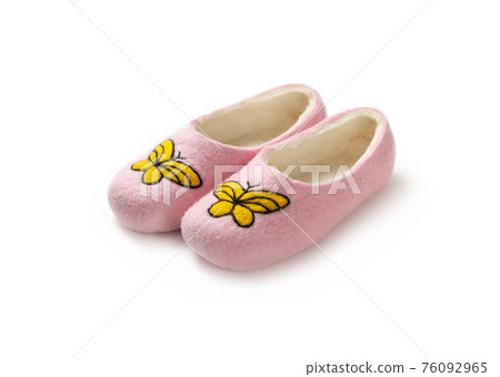 Felt slippers on white background in closeup Felt slippers on white background in closeup 76092965