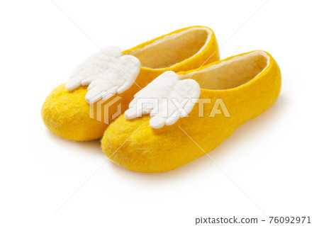 Felt slippers on white background in closeup 76092971