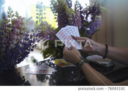 Blurred background of Tarot cards on table 76093192