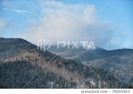 Sunrise in a Valley at Foggy Morning Mountains Landscape 76093803