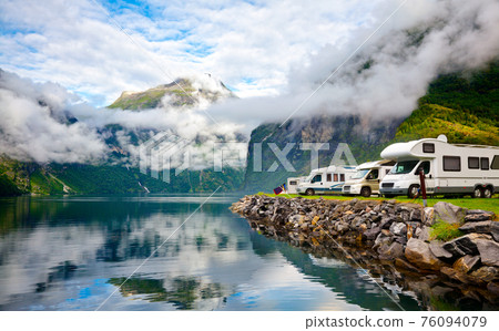Campervan RV vehicles at norwegian camping by a fjord Campervan RV vehicles at norwegian camping by a fjord 76094079