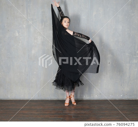 Woman dancer in motion with piece of fabric Woman dancer in motion with piece of fabric 76094275