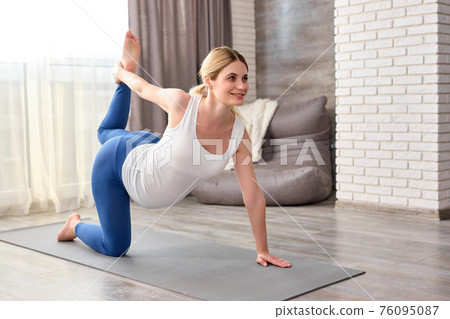 pregnant woman doing exercises for warm-up legs and arms pregnant woman doing exercises for warm-up legs and arms 76095087