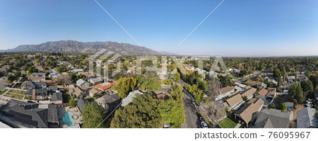 Aerial view above Pasadena neighborhood in California 76095967