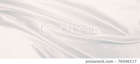 Smooth elegant grey silk or satin luxury cloth as wedding background. Luxurious background design Smooth elegant grey silk or satin luxury cloth as wedding background. Luxurious background design 76096517