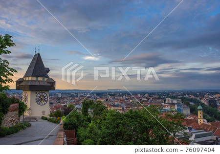 Cityscape of Graz and the famous clock tower (Grazer Uhrturm) on Shlossberg hill, Graz, Styria region, Austria 76097404