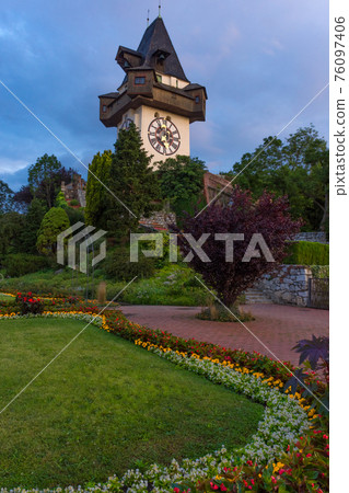 The famous clock tower (Grazer Uhrturm) and gardens on Shlossberg hill, Graz, Styria region, Austria The famous clock tower (Grazer Uhrturm) and gardens on Shlossberg hill, Graz, Styria region, Austria 76097406