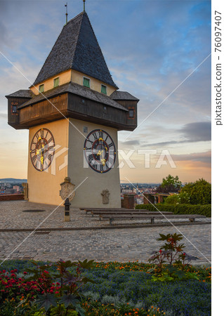 The famous clock tower (Grazer Uhrturm) and gardens on Shlossberg hill, Graz, Styria region, Austria 76097407