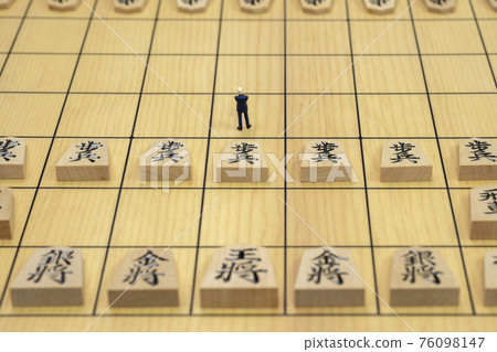 Shogi pieces and miniature businessmen Shogi pieces and miniature businessmen 76098147