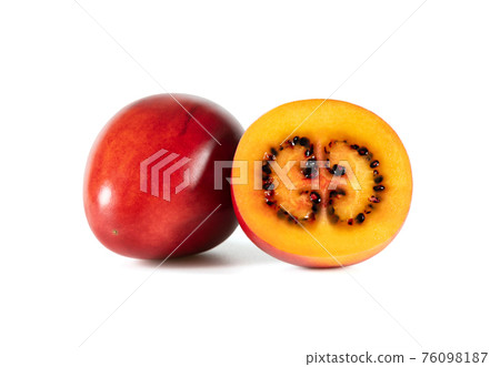 Tamarillo fruit isolated on a white background. Juicy sliced tamarillo. Tamarillo fruit isolated on a white background. Juicy sliced tamarillo. 76098187