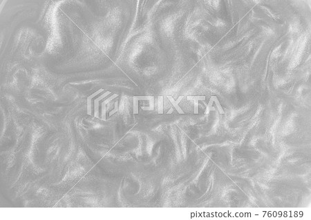 Silver paint background. Motion of the shiny liquid. Color of the year 2021 Ultimate Grey. Waves on a glittering liquid surface. 76098189