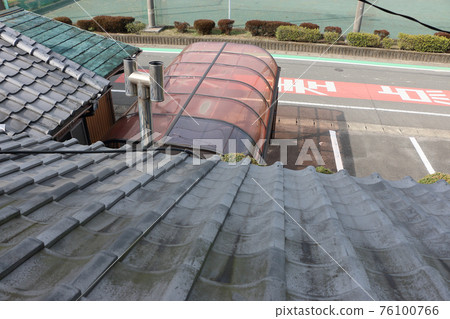 Repairing the roof of a garage that flew in the wind of a typhoon Repairing the roof of a garage that flew in the wind of a typhoon 76100766