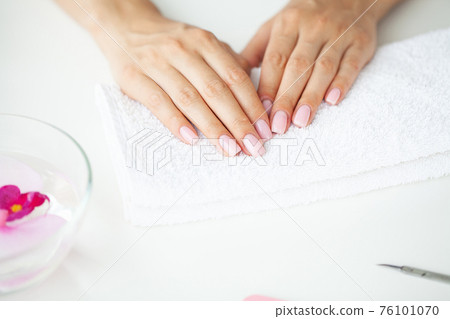 Woman making manicure when resting at home 76101070