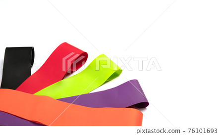 Banner fitness, gym concept. Elastic expanders for sports training isolated. Set of colorful latex rubber bands for fitness on white background. Banner fitness, gym concept. Elastic expanders for sports training isolated. Set of colorful latex rubber bands for fitness on white background. 76101693