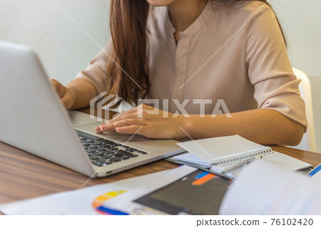 Young freelancer working on laptop at home Young freelancer working on laptop at home 76102420