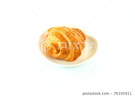 Freshly baked ham and cheese croissant on white plate. Ham and Cheese croissant sandwich, homemade isolate with white background. French pastry. 76105911