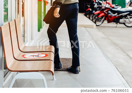Alternative seating mark for social distance rules in front of the bank distance for one seat from other people to protect from Corona Virus(COVID-19), Social distancing for infection risk. 76106031
