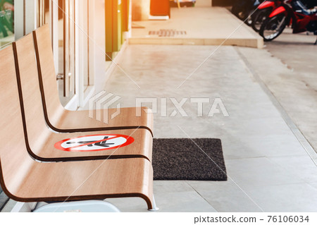 Alternative seating mark for social distance rules in front of the bank distance for one seat from other people to protect from Corona Virus(COVID-19), Social distancing for infection risk. 76106034
