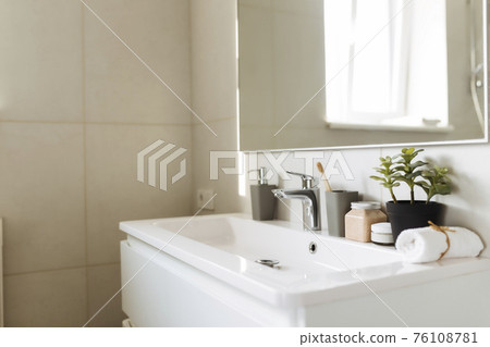 Washbasin in bathroom, bath accessories. Household, hotel cleaning concept Washbasin in bathroom, bath accessories. Household, hotel cleaning concept 76108781