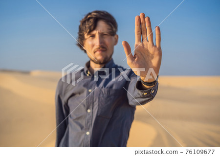 The man calls for an end to climate change. No trash, no greenhouse gases, reduced carbon dioxide emissions 76109677