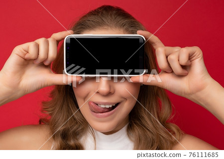 closeup Photo of sexy beautiful smiling young woman standing isolated on background with copy space 76111685