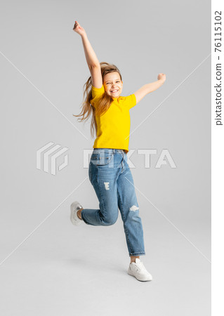 Happy kid, girl isolated on white studio background. Looks happy, cheerful, sincere. Copyspace. Childhood, education, emotions concept Happy kid, girl isolated on white studio background. Looks happy, cheerful, sincere. Copyspace. Childhood, education, emotions concept 76115102