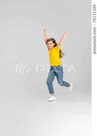 Happy kid, girl isolated on white studio background. Looks happy, cheerful, sincere. Copyspace. Childhood, education, emotions concept 76115104