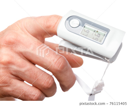 Person using pulse oximeter to check oxygen saturation tracking coronavirus symptoms at home 76115405