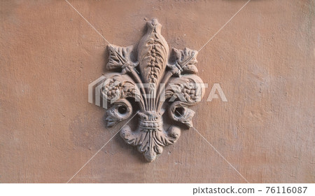 lily symbol of Florence in relief on a old terracotta tile lily symbol of Florence in relief on a old terracotta tile 76116087
