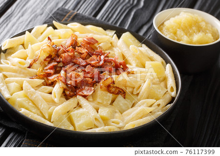 Alpine style macaroni with apple puree closeup in the plate. horizontal 76117399
