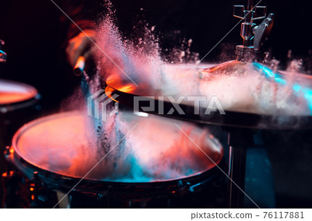 Drummer's rehearsing on drums before rock concert. Man recording music on drumset in studio 76117881