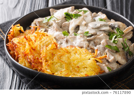 Zurich Geschnetzeltes a classic Swiss Veal Dish closeup in the plate. Horizontal Zurich Geschnetzeltes a classic Swiss Veal Dish closeup in the plate. Horizontal 76117890