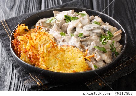 Zurcher Geschnetzeltes is a rich elegant dish of sliced veal, pan seared and drenched in a wine cream sauce in the plate. Horizontal 76117895