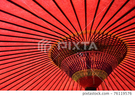 Inside the elegant red Japanese umbrella 76119576