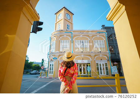 Travelers on street Phuket old town with Building Sino Portuguese architecture at Phuket Old Town area Phuket, Thailand. Travel concept Travelers on street Phuket old town with Building Sino Portuguese architecture at Phuket Old Town area Phuket, Thailand. Travel concept 76120252