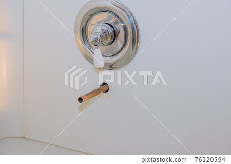 Plumbing installing copper pipe in the wall on new tap bathroom 76120594