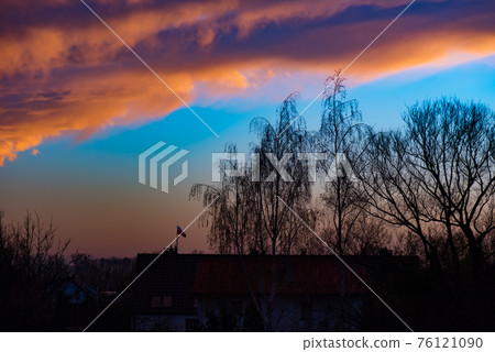 Houses and trees at sunset Houses and trees at sunset 76121090