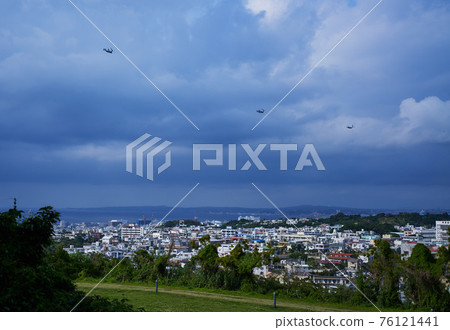 Three Ospreys flying over Urasoe Three Ospreys flying over Urasoe 76121441