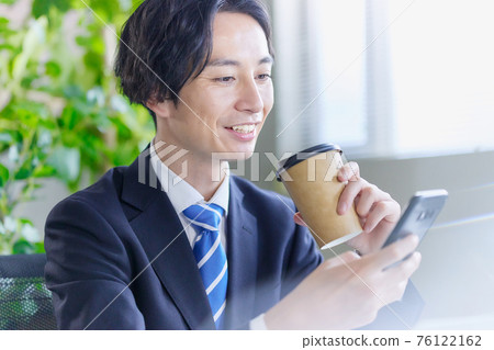 Businessman calling in the office Businessman calling in the office 76122162