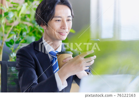Businessman calling in the office Businessman calling in the office 76122163